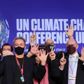 Delegates pose for a picture during the UN Climate Change Conference (COP26) in Glasgow, Scotland, Britain November 13, 2021. REUTERS/Yves Herman
