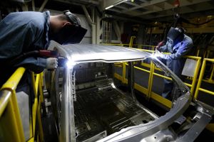 In this March 13, 2015 photo, workers weld body panels on the new aluminum-alloy body Ford F-150 truck at the company's Kansas City Assembly Plant in Claycomo, Mo. The Labor Department releases first-quarter productivity data on Wednesday, May 6, 2015. 