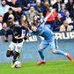 Kevin Conboy er 31 år og er nu en profil i Superliga-klubben Randers FC. Her ses han i duel med AGF-spilleren Mustapha Bundu. Foto: Ernst van Norde/Ritzau Scanpix