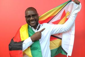 This photo taken Tuesday May 3, 2016 shows Evans Mawarire, a young pastor, posing with a Zimbabwean flag wrapped around his body, in Harare. Mawarire launched a media campaign called Thisflag" to protest alleged government failures and asserting the meaning of the national emblem. (AP Photo/Tsvangirayi Mukwazhi)