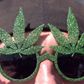 Carlsberg har ingen øjeblikkelige planer om at brygge en drik, der indeholder cannabis eller marihuana, men det kan komme. Her er en tilhænger af fri marihuana fra en tidligere demonstration i Tyskland for legalisering af den grønne plante. Foto: AP/Britta Pedersen