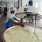 Osteproduktionen starter tidligt om morgenen, hvor skummet komælk fra om aftenen blandes med fuldmælk fra om morgenen i store kobberkar, der hver rummer 1.000 liter.
