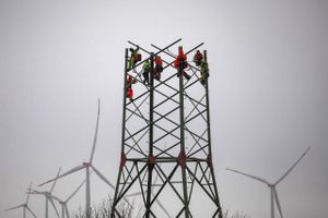 Assembling a high-voltage electricity transmission tower in Germany in April. Bloomberg photo by Krisztian Bocsi.