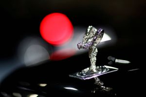 Headline: FILE PHOTO: The "Spirit of Ecstasy" bonnet ornament of a Rolls-Royce car is seen at the headquarters of Chabe, Chauffeured Cars Services, in Nanterre
Description: FILE PHOTO: The mascot, the so-called Spirit of Ecstasy or Emily, is pictured on a Rolls Royce car displayed at the headquarters of Chabe, Chauffeured Cars Services, in Nanterre near Paris, France, July 2, 2020.REUTERS/Gonzalo Fuentes/File Photo