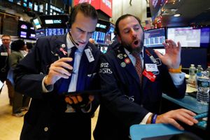 In this Dec. 5, 2019, file photo, trader Gregory Rowe, left, and specialist Michael Pistillo work on the floor of the New York Stock Exchange. The U.S. stock market opens at 9:30 a.m. EST on Thursday, Dec. 12. (AP Photo/Richard Drew, File)
