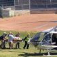 In this frame grab from a video courtesy of Horatio Gates recorded on August 12, 2022, Salman Rushdie is seen being loaded onto a medical evacuation helicopter near the Chautauqua Institution after being stabbed in the neck while speaking on stage in Chautauqua, New York. - Rushdie, whose controversial writings made him the target of a fatwa that forced him into hiding, was stabbed in the neck by an attacker on stage Friday in western New York state, according to New York State Police. The attacked is in custody. (Photo by Handout / AFP) / RESTRICTED TO EDITORIAL USE - MANDATORY CREDIT "AFP PHOTO / HORATIO GATES" - NO MARKETING NO ADVERTISING CAMPAIGNS - DISTRIBUTED AS A SERVICE TO CLIENTS