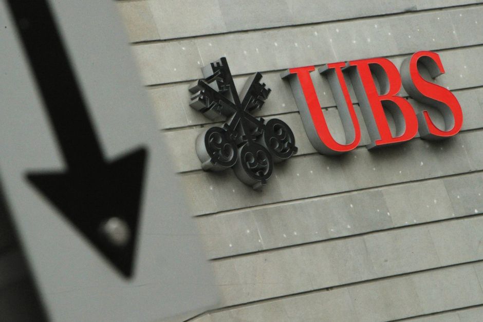 FILE -In this Jan. 24, 2013 file photo the logo of Swiss bank UBS is pictured in Zurich, Switzerland. UBS has reported a 14-percent drop in net profit in the second quarter, Friday, July 29, 2016, citing "pronounced low client activity" amid economic and geopolitical uncertainties and other market weakness. (Steffen Schmidt/Keystone via AP, File)
