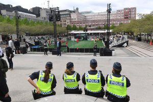 Police officers sit in the Fan Zone in Stockholm, Tuesday May 23, 2017, a day ahead of the Europa League soccer final between Ajax Amsterdam and Manchester United. After a deadly bombing at a concert in Manchester, UEFA said Tuesday it has "no specific intelligence" that the Europa League final featuring Manchester United will be a target. (Fredrik Sandberg/TT via AP)