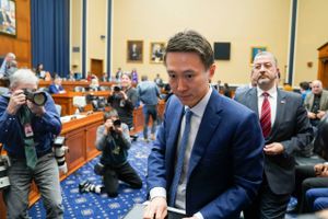 TikTok CEO Shou Zi Chew exits the room during a break in Thursday's congressional hearing. Washington Post photo by Jabin Botsford