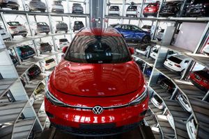 Volkswagen ID. 4 electric vehicles being maneuvered into storage bays in Wolfsburg, Germany. Bloomberg photo by Krisztian Bocsi