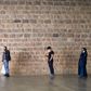 Customers wearing protective masks practice social distancing while waiting in line to enter a supermarket, during the coronavirus disease (COVID-19) outbreak, in Barcelona, Spain April 11, 2020. REUTERS/Nacho Doce