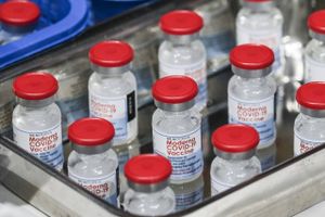 Vials of the Moderna Inc. Covid-19 vaccine at a vaccination site inside a gymnasium in San Juan City, Metro Manila, the Philippines, on Tuesday, Dec. 28, 2021. The Philippines has shortened the interval for administering Covid-19 vaccine boosters amid the threat of the omicron variant. Bloomberg photo by Veejay Villafranca