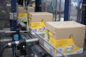Boxes of Becel squeeze bottle margarine pass along the packaging line inside the Unilever factory in Rotterdam, Netherlands, on Thursday, May 11, 2017. Unilever's announcement that it's looking at ending its dual nationality and basing itself in London or Rotterdam means Theresa May finds her Brexit strategy facing either a big endorsement or an early blow. Bloomberg photo by Jasper Juinen