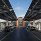 De nye eltankstationer, som har 35 ladere, er klar til 350 kW og er udstyret med solfangere på taget, der sammen med solfangerfarme leverer strømmen til bilerne. Foto: Gridserve